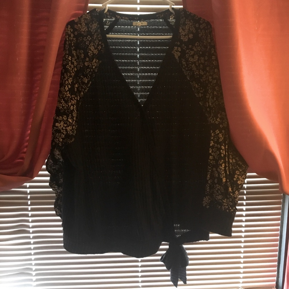 Black top with flowery sleeves